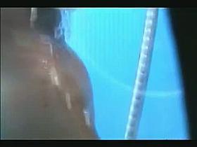 Hidden cam in the shower catches a busty blonde