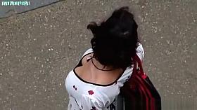 Girls in white, flowered blouse.