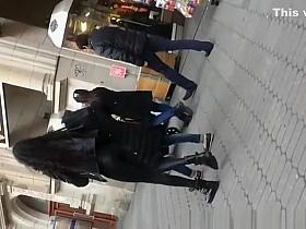 Skinny brunette in tight black pants