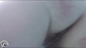 Naked women underwater at a nudist resort pool