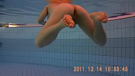 Amateur beauty is swimming nude on under water spy cam 3