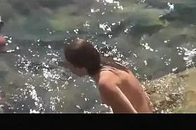 Naked woman sunbathes her nice body