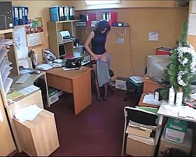 Hidden cam brunette in office
