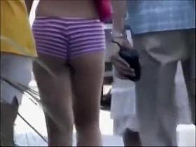 Saucy blonde babe walks around the town wearing revealing clothes