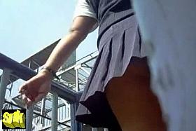 Sexy teen climbing up the stairs and demonstrating her ass