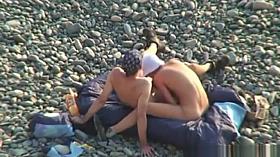 Voyeur on public beach. Oral sex