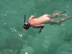 Naked diving girl spied by a voyeur