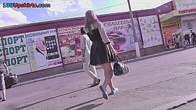 Babe with auburn hair excites in the upskirt video