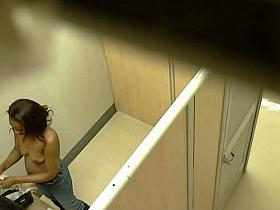 Ebony chick caught topless in the changing room