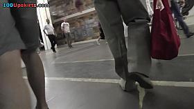 Model-style babe shows sexy upskirt view on the stairs