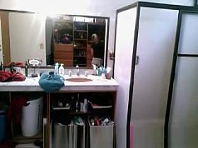 Blonde dressing in bathroom