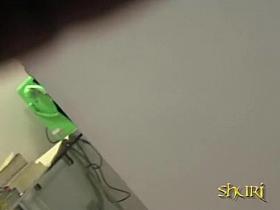 A guy sharking skirt while she was talking on the payphone