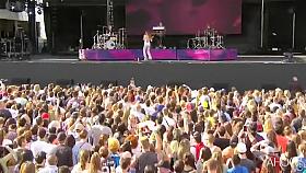 Attractive inked singer shows off one of her tits at a show