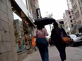 Brunette MILF with big round booty in tight trousers