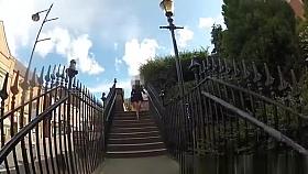 Woman in black dress upskirted in shopping mall