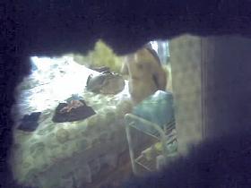 Spy cam erotica with the amateur topless in the room