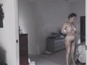 Mature woman undressing - spy cam