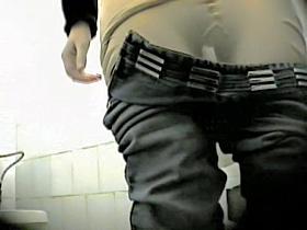 Blonde in glasses getting voyeured in the public toilet