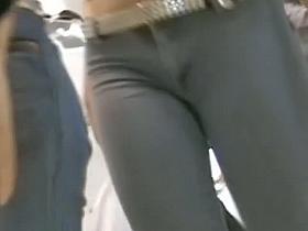 Cute brunette treats us to her camel toe in a hot candid video