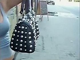 Blonde girl's boobs spied on a street