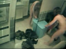 Wife stripping and staying nude before mirror in bathroom