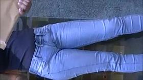 Talkative brunette in tight jeans pants