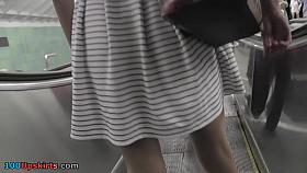 Upskirt video of an auburn-hair cougar with g-string