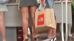 Tight voyeur skirts in the middle of the crowd in a shop