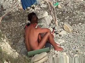 Wife strokes his man dick in beach