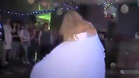 Foxy slim blonde performs a sensual striptease in a wedding dress