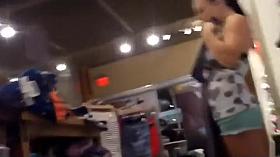 Young store clerk caught bending over