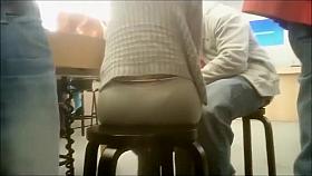 Hot woman sitting on a stool has her huge butt filmed