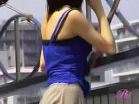 Girl on the balcony talking on the phone got skirt sharked