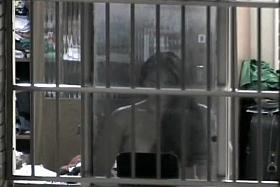 Peeping on her through a window