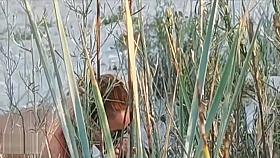 Amateur couple got caught having sex on the beach by voyeur.
