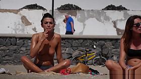 Horny Tanned Topless Babe with Pierced Nipple Filmed on Beach by Voyeur