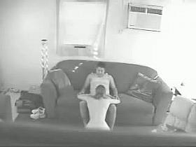 A married couple has sex on the couch