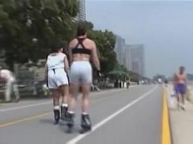 Girls in candid sports shorts roller skating in the street 07zt