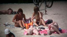 2 white babes with nice big side saggin breasts on a nude beach