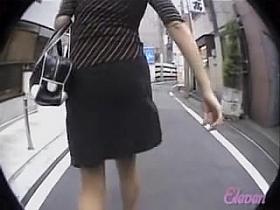 Leaving the office in her fancy clothes skirt sharking