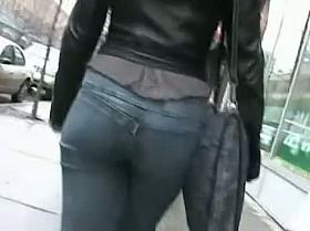 Good-looking babe with round ass having a long walk