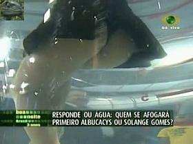 Cute brunette show girl offers hot up skirt on tv