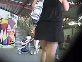 Pretty butt under a short skirt