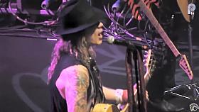 Foxy redhead bombshell shows off her tits at a rock concert