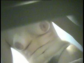 Amateur in dressing room puts on lingerie showing nudity