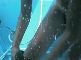 Girl stripping off bikini and washing naked charms