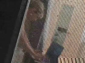 Voyeur secretly films his milf neighbor through window