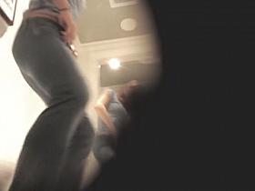 Blonde in fitting room puts on panty and tight jeans