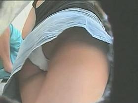 Candid street upskirt with sexy brunette in short skirt