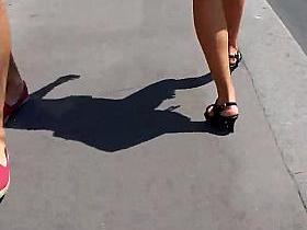 beautifull legs walking in the street in mini shorts